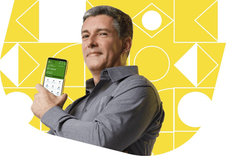 Homem branco com celular exibindo o app PagBank, representando praticidade e controle financeiro com carteiras recomendadas para investir com segurança.